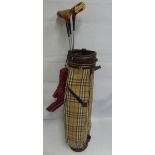 Three Mac Gregor Golfing Woods, 1, 3 & 5 together with a vintage Burberry golf bag.