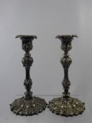 Two Pewter Nut Dishes, in the form of walnuts together with two plated candlesticks. (4)