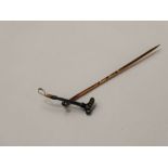 An Antique Rose Cut Diamond and Gold Tie Pin, in the form of a riding crop, approx 1.3 gms