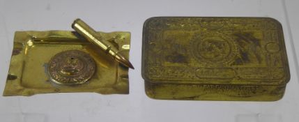 A WWI Brass Christmas 1914 Chocolate Box, together with a trench art ashtray. (2)