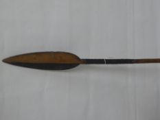 A Wooden Ceremonial Tribal Spear, with decorative hilt.