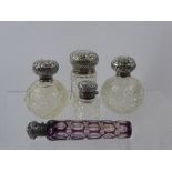 Four Cut Glass and Silver Perfume Bottles together with a lilac faceted scent bottle. (5)