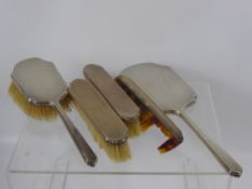 A Solid Silver Dressing Table Set, including two clothes brushes, hair brush, mirror and comb,