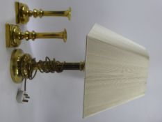 An Antique Brass Column Desk Light, together with a pair of brass candlesticks. (3)