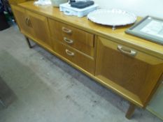 A Teak G-Plan Style Retro Sideboard, the sideboard having double cupboard to one end, three