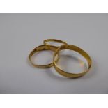 Two 22 ct Gold Wedding Bands, approx 2.7 gms together with a 18 ct gold and seed pearl ring (af),