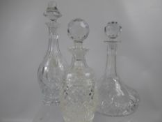 Three Cut Glass Decanters, including wine and ship's decanter. (3)