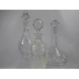 Three Cut Glass Decanters, including wine and ship's decanter. (3)