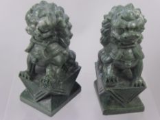 A Pair of Soap Stone Oriental Carvings, in the form of guardian lions, approx 21 cms