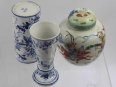 Two Continental Blue and White Vases, with floral decoration together with a ginger jar and cover