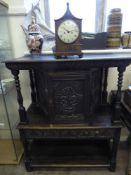 An Elizabethan Style Mahogany Court Cupboard, having central cupboard with carved decoration and a