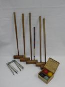 A Set of Vintage Croquet Set, comprising five adult mallets, one child mallet, six cast iron hoops