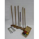 A Set of Vintage Croquet Set, comprising five adult mallets, one child mallet, six cast iron hoops