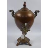 A 19th Century Copper Samovar, in original condition with porcelain handles and brass pouring spout,