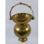 An Early 20th Century Brass Spittoon, waisted bulbous form with decorative handle approx 35 cms