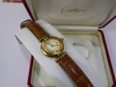 A Lady's Vintage Silver Gilt Cartier Wrist Watch, white enamel face with Roman dial, the case nr