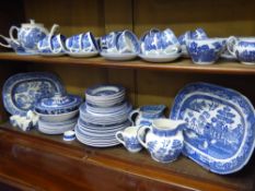 A Quantity of Blue and White Willow Pattern, including plates, dishes, jugs, cups etc