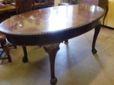 A Mahogany Oval Dining Table, single leaf, raised on ball and claw feet, approx 210 x 105 cms