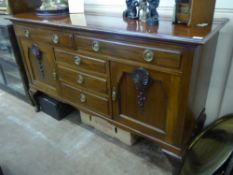 An Edwardian Mahogany Buffet Sideboard, with two cutlery drawers, with three central short drawers