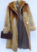 A Vintage Beaver Lamb 3/4 Coat by D H Evans London WI, size medium, together with a vintage