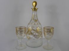 A Late 18th Century Cut Glass Decanter and Stopper, with decorative swag gilding, and six matching