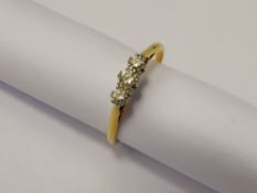 A Lady's 18 ct Gold and Platinum Three Stone Diamond Ring, approx 28 pts, size V, approx 2.6 gms