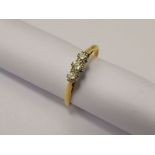 A Lady's 18 ct Gold and Platinum Three Stone Diamond Ring, approx 28 pts, size V, approx 2.6 gms