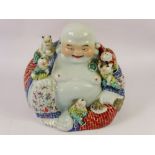 A Decorative Ceramic Figure of The Laughing Buddha, depicted seated with clambering children, approx