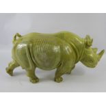 A Large Butter Jade/Hardstone Rhinoceros, approx 54 x 26 cms, signed David Sibanda. (af)