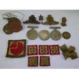 A Miscellaneous collection of Military Badges including collar pips, cap badges, buttons, coins, dog