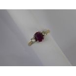 A Lady's Antique 18 ct Yellow Gold and Platinum Three Stone Ruby and Diamond Ring, the ruby approx 7