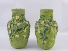 A Pair of Thomas Bevington Moss Ware Vases, with textured green body and floral design in relief,