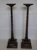 A Pair of Mahogany Barley Twist Torchere, on stepped plinth base with decorative brass ornament,