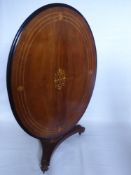 A Victorian Oval Looe Table, with decorative marquetry inlay, central column on pedestal base,