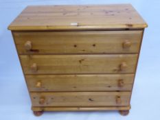 A Contemporary Pine Chest of Drawers, approx 88 x 45 x 88 cms together with a circular pine
