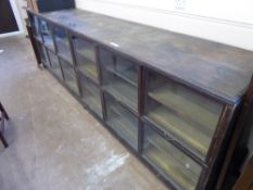 A Vintage Mahogany Shop Display Unit, with six hinged glass fronts and shelving beneath, approx
