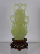 Chinese 20th Century Pale Celadon Vase and Cover, the pear shaped vase features white inclusions and