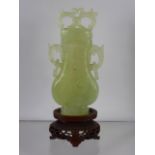 Chinese 20th Century Pale Celadon Vase and Cover, the pear shaped vase features white inclusions and