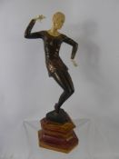 An Art Deco Dancer, raised on a rose marble plinth, approx 35 cms, unsigned.