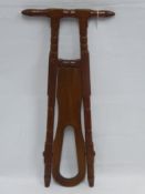 An Antique Mahogany Boot Jack, approx 85 x 40 cms.