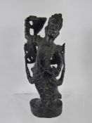 Four South East Asian Wooden Carvings of Deity, the first in a kneeling position approx 21.5 cms