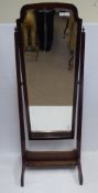 A Mahogany Framed Cheval Mirror, approx 62.5 x 52 x 168 cms, with decorative carving to the base.