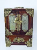 An Oriental Jewellery Chest, two cupboards with jade inserts which, when opened, reveal three