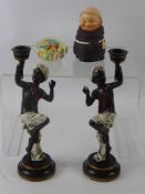 A Pair of Resin Blackamoor Candlesticks, together with a Goebel Friar and a Millefiori Glass