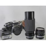 An Olympus Camera, together with wide angle lens, Super Ozeck II 300m lens, Olympus flash, fitted