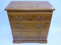 A Contemporary Pine Chest of Drawers, approx 78 x 45 x 83 ms, with brass handles.