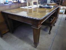 An Edwardian Mahogany Wind Out Dining Table, raised on square form tapering legs, together with