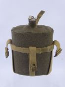 A Vintage Military Cloth Covered Enamelled Hip Flask, having original felt cover and canvas