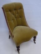 An Antique Slipper Chair, upholstered in celadon green, turned legs on castors.