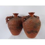 A Pair of Antique Chinese Terracotta Dragon Twin Handled Vases, the vases having handles in the form